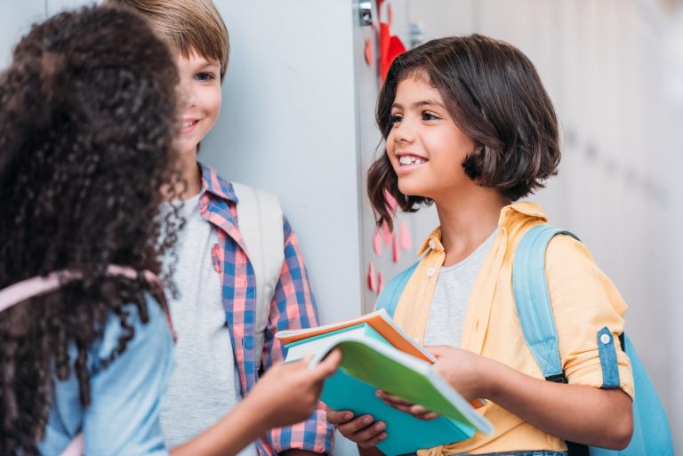 pupils talking in school next to school lockers